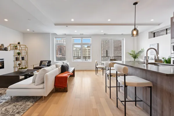 a living room with furniture a window and appliances