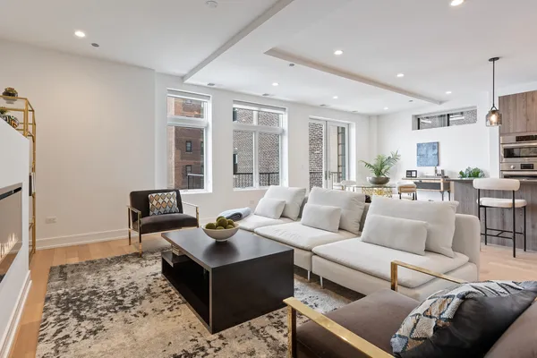 a living room with furniture and a rug