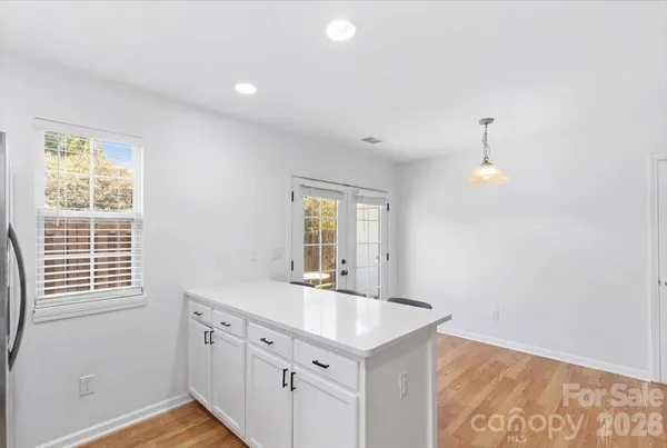 a bathroom with a sink vanity and a mirror