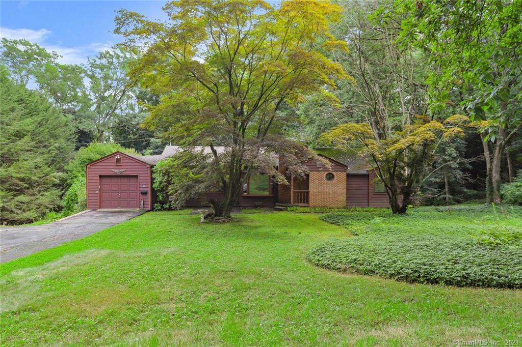front view of a house with a yard