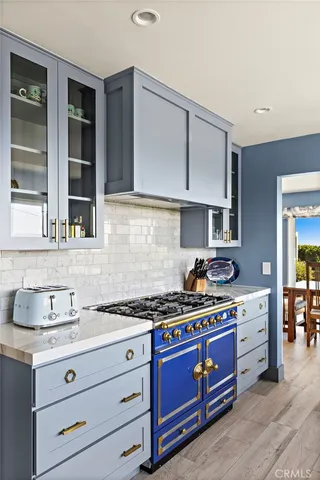 a kitchen with granite countertop a stove and a sink