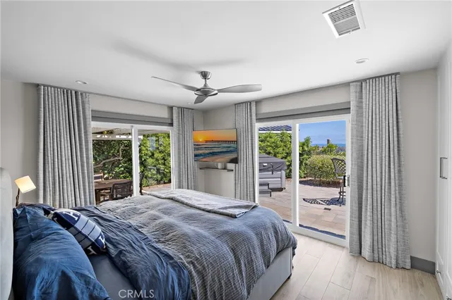 a bedroom with a large bed and a large window