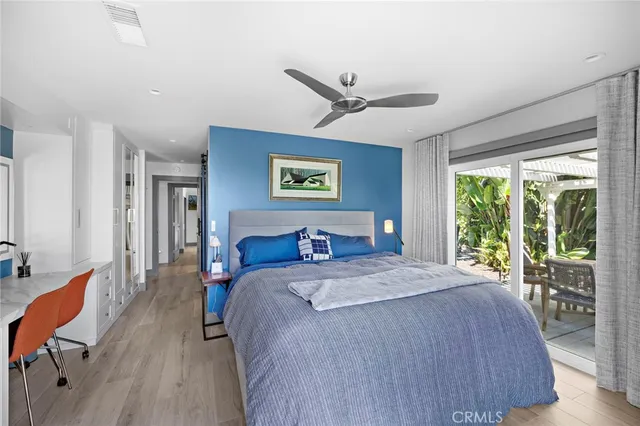 a bedroom with a large bed and a large window