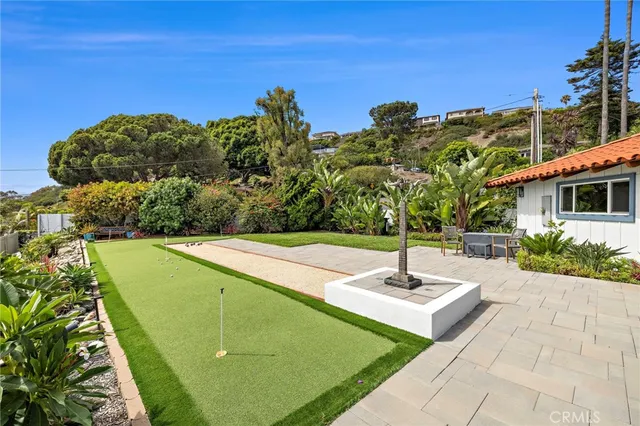 a swimming pool with some trees in the background