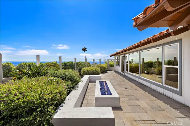 a view of house with a swimming pool