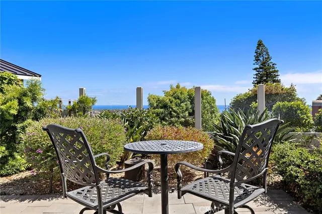 a view of a chairs and table in patio