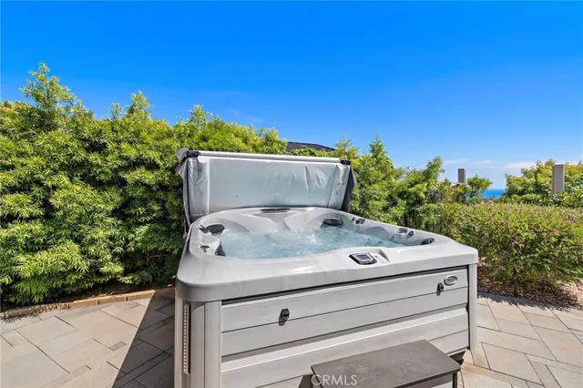 a white house with a tree in the background