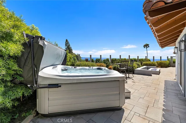a view of a patio with a table and chairs