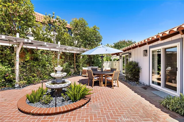 a view of a patio with chair and tables