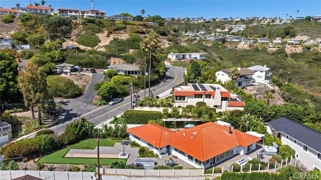 an aerial view of residential building and ocean
