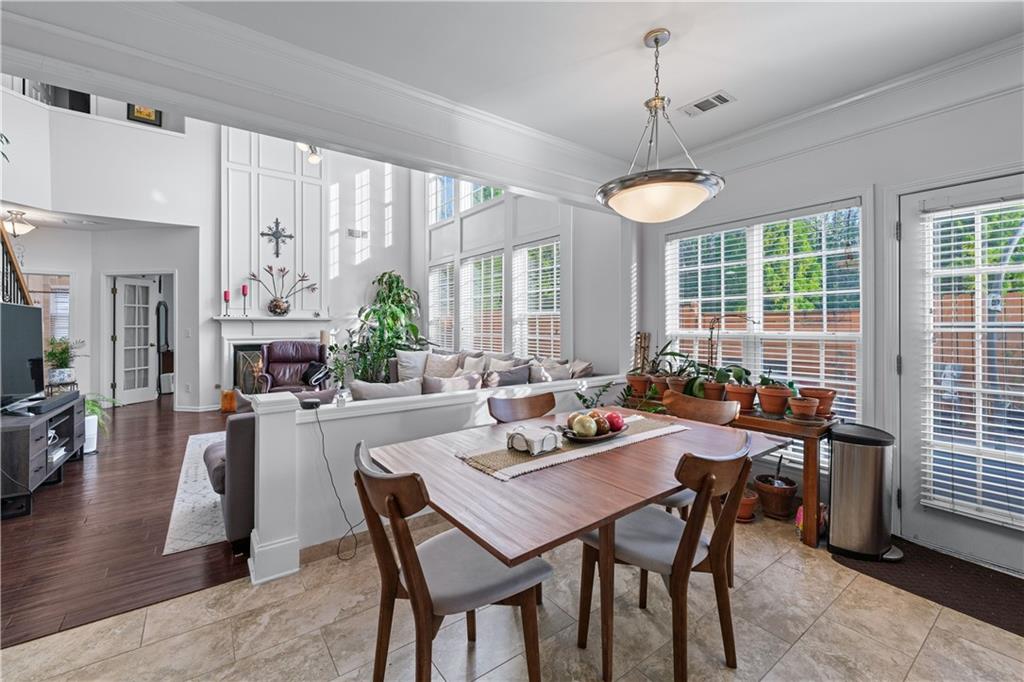 135 Splinter Court Suwanee, GA 30024 - Photo 12 of 47 a view of a dining room with furniture window and wooden floor