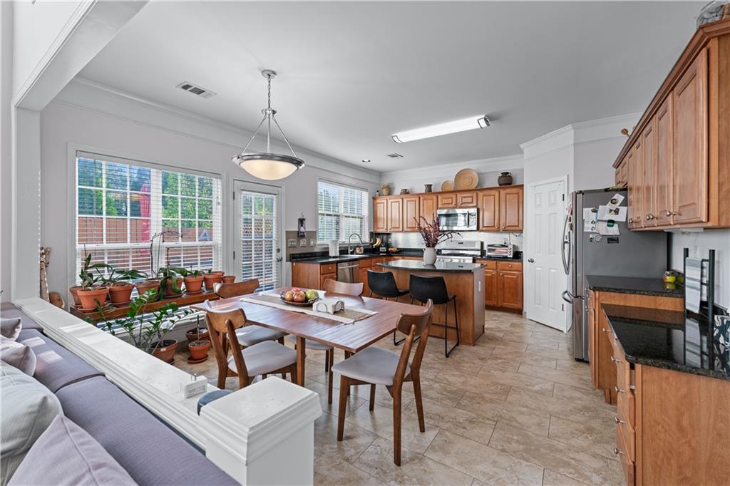 135 Splinter Court Suwanee, GA 30024 - Photo 13 of 47 a group of people sitting in a living room