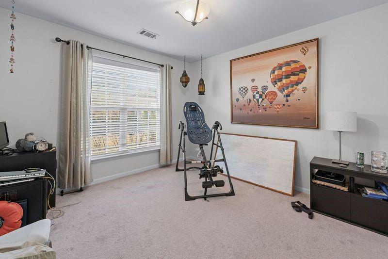 135 Splinter Court Suwanee, GA 30024 - Photo 25 of 47 a view of a livingroom with furniture and a window