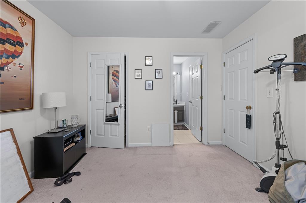 135 Splinter Court Suwanee, GA 30024 - Photo 26 of 47 a view of a bathroom with a tub and shower