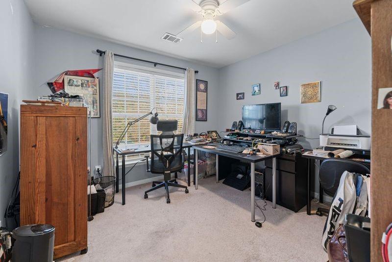 135 Splinter Court Suwanee, GA 30024 - Photo 27 of 47 a view of a workspace with furniture and a window