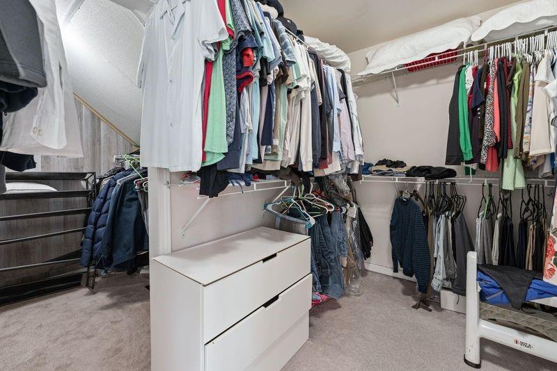 135 Splinter Court Suwanee, GA 30024 - Photo 33 of 47 a view of walk in closet with clothes