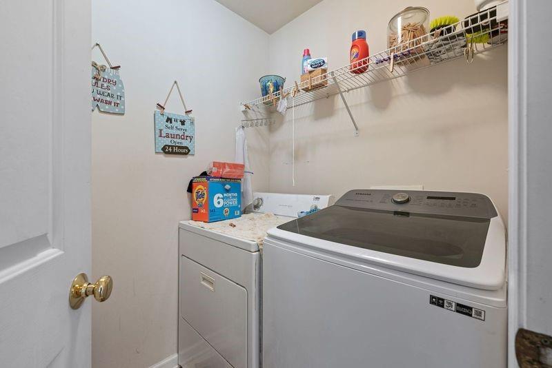135 Splinter Court Suwanee, GA 30024 - Photo 34 of 47 a utility room with dryer and washer