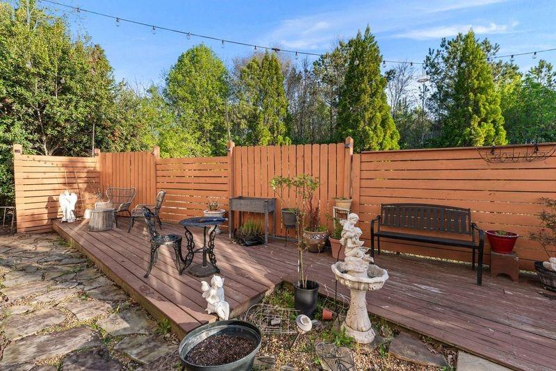 135 Splinter Court Suwanee, GA 30024 - Photo 36 of 47 a view of a patio with wooden chairs