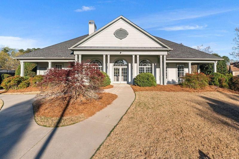 135 Splinter Court Suwanee, GA 30024 - Photo 41 of 47 front view of a house with a yard