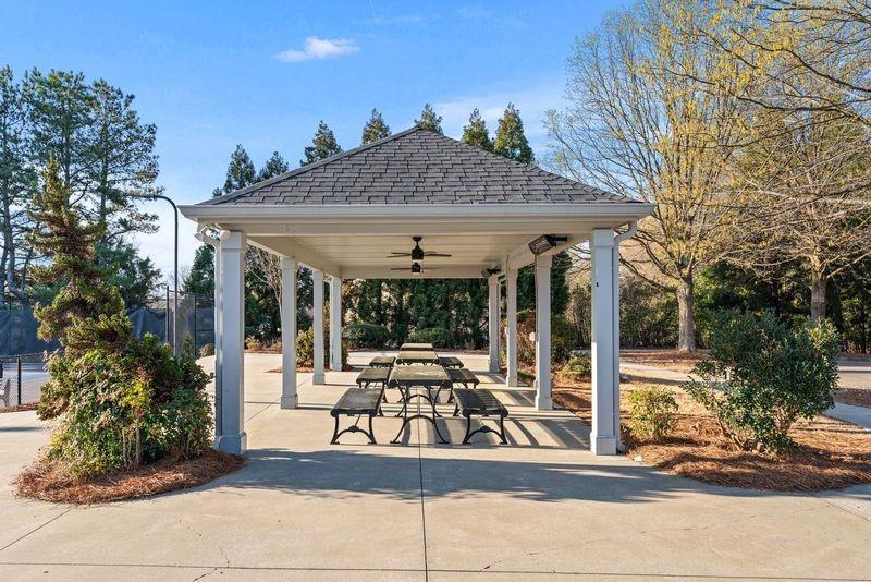 135 Splinter Court Suwanee, GA 30024 - Photo 43 of 47 a patio with table and chairs and potted plants