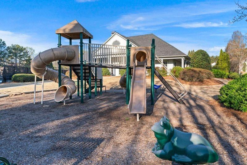 135 Splinter Court Suwanee, GA 30024 - Photo 47 of 47 a front view of a house with a yard