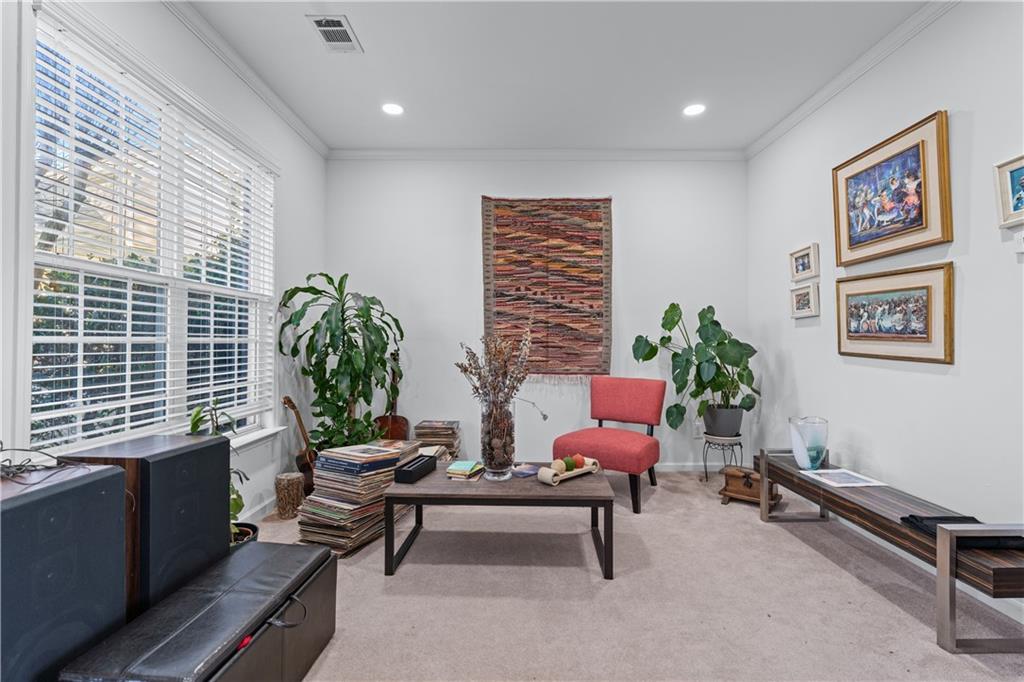 135 Splinter Court Suwanee, GA 30024 - Photo 8 of 47 a living room with furniture a window and a potted plant