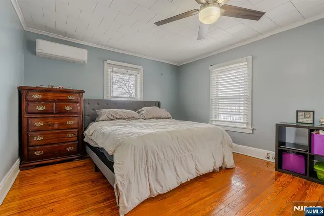 a bedroom with a bed and a tv