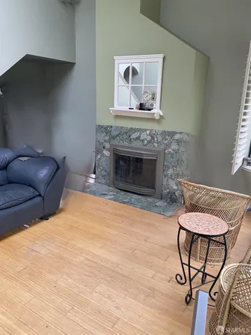 a view of a livingroom with furniture and a fireplace