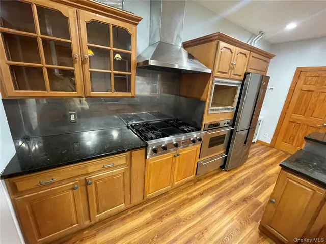 a kitchen with granite countertop a stove and a sink