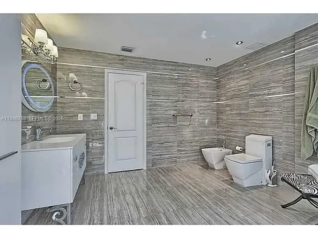 a bathroom with a sink a toilet and bathtub