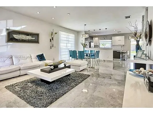 a living room with furniture and a table