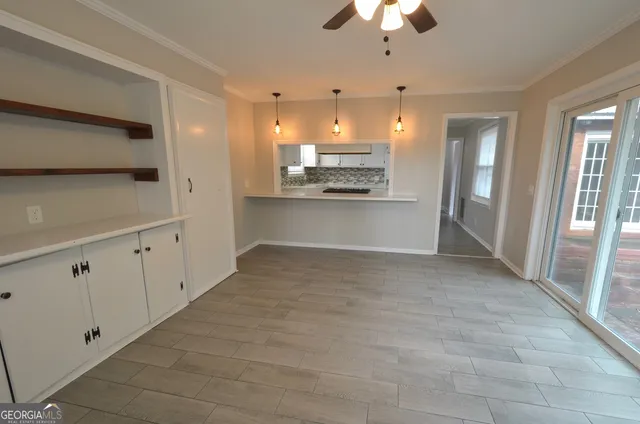 a view of a kitchen with a sink and cabinets