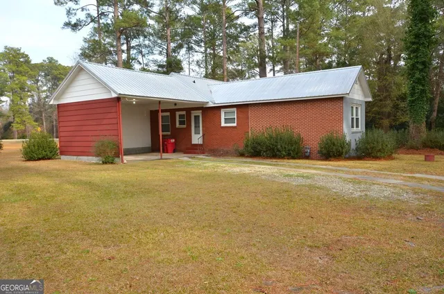 a front view of a house with yard and garage