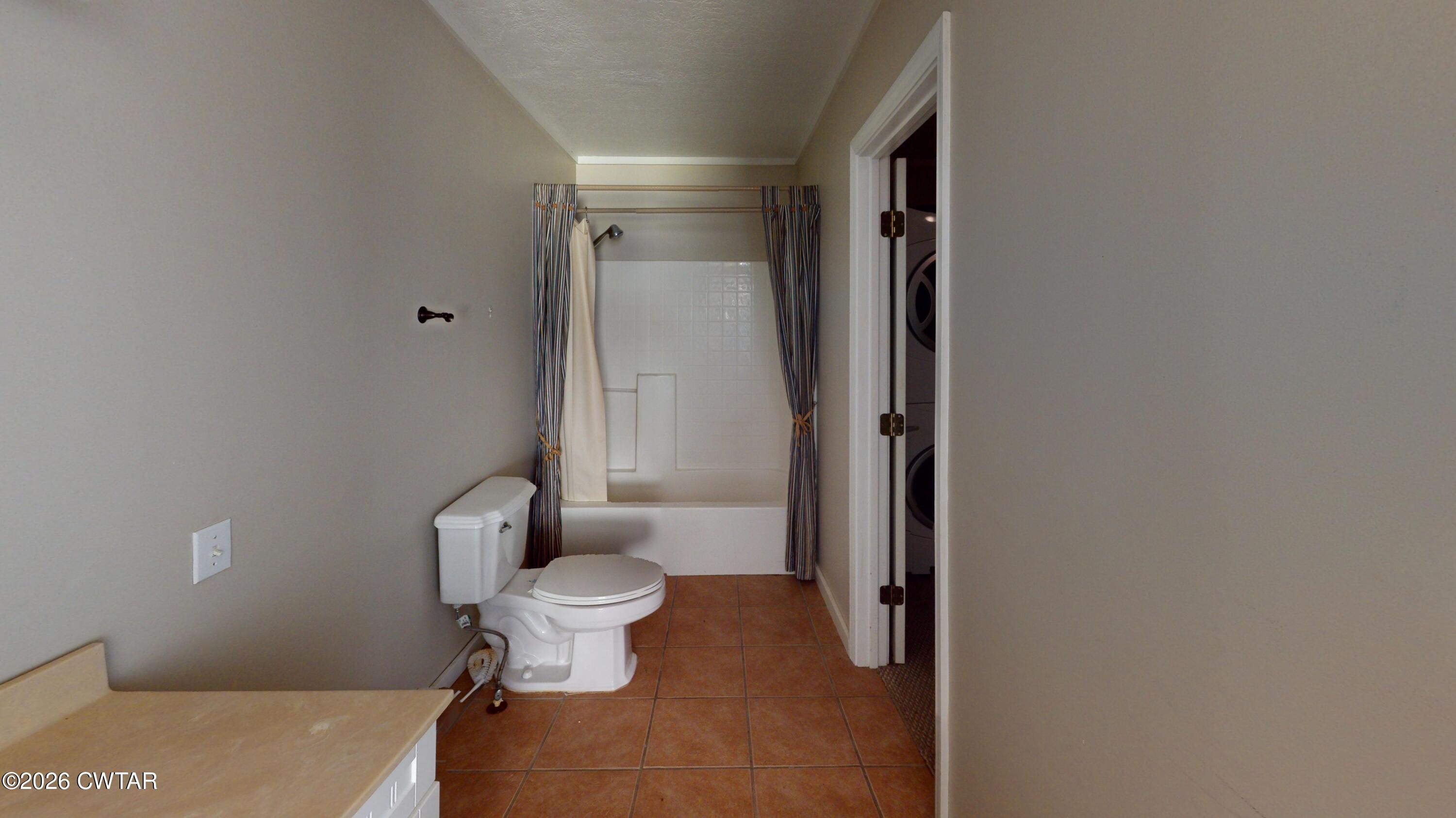 1532 Jackson Hill Road Hornbeak, TN 38232 - Photo 18 of 50 a bathroom with a toilet and a shower
