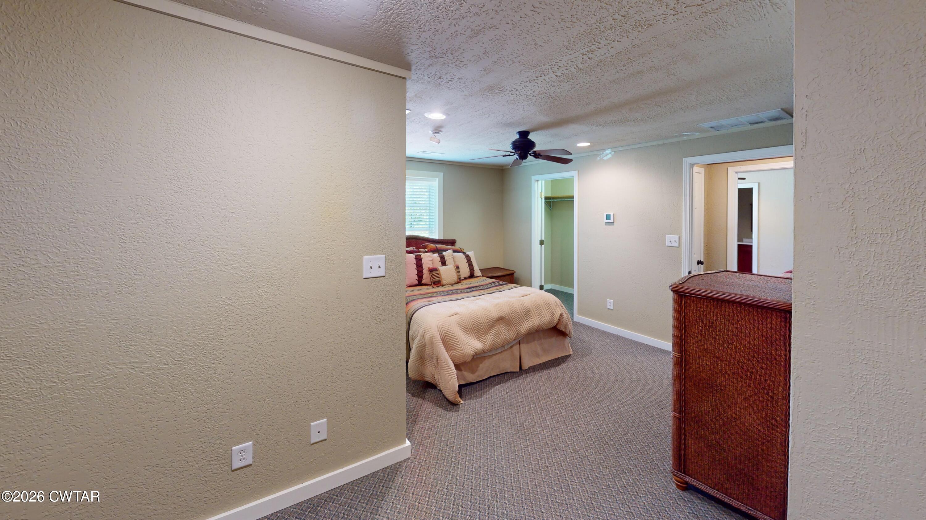 1532 Jackson Hill Road Hornbeak, TN 38232 - Photo 24 of 50 a bedroom with a bed and a lamp