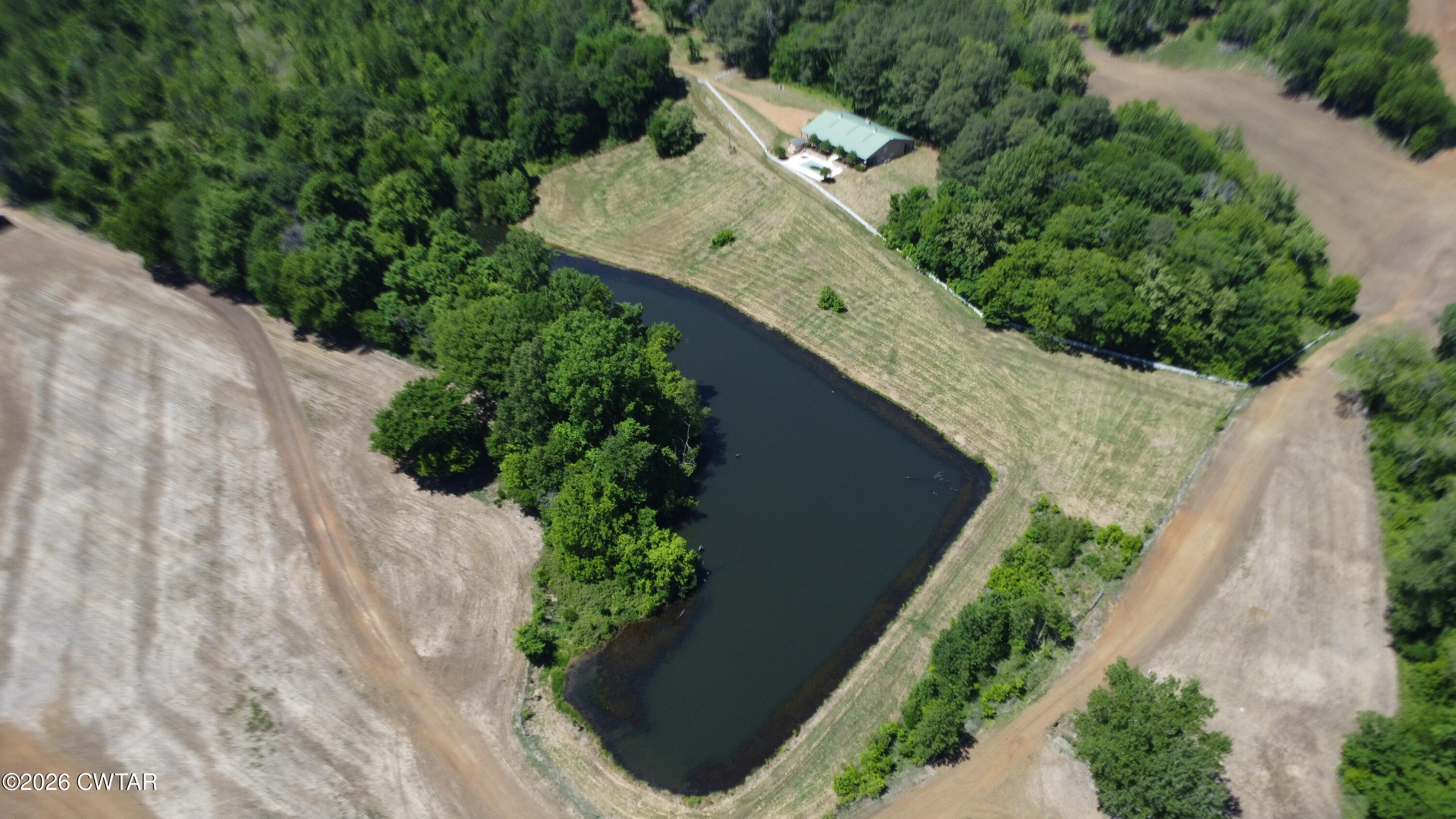 1532 Jackson Hill Road Hornbeak, TN 38232 - Photo 40 of 50 an aerial view of a house with a yard and trees