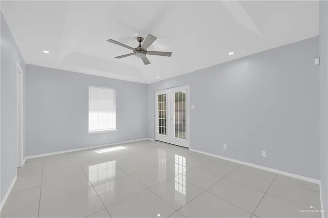 a bathroom with a granite countertop sink shower and a mirror