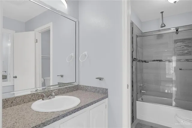 a bathroom with a shower and a bath tub