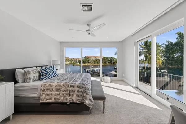 a bedroom with a bed and a couch