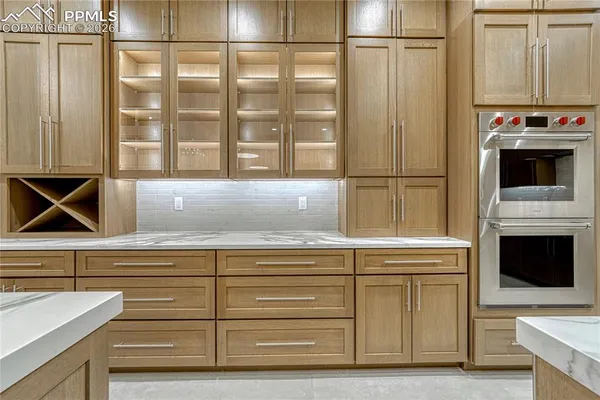 a kitchen with a sink and a refrigerator