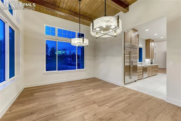 a view of a room with a chandelier and living room view