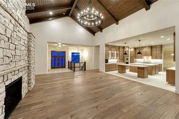 a view of a kitchen with a sink stainless steel appliances and cabinets