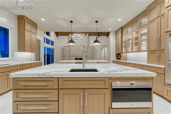 a kitchen with a sink and cabinets