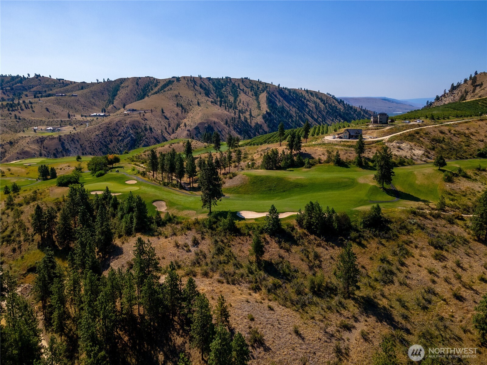 322 Paintbrush Road Chelan, WA 98816 - Photo 16 of 26 a view of a houses with a big yard