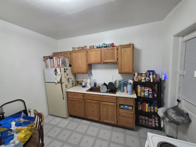 a kitchen with a sink and a stove top oven