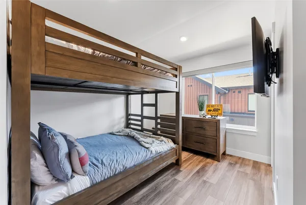 a bedroom with a bed and cabinets