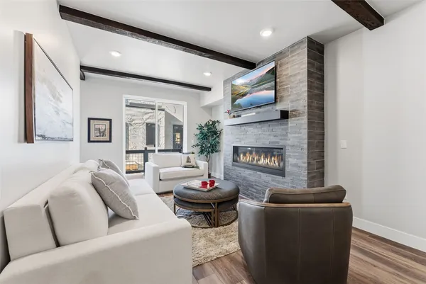 a living room with fireplace furniture and a fireplace