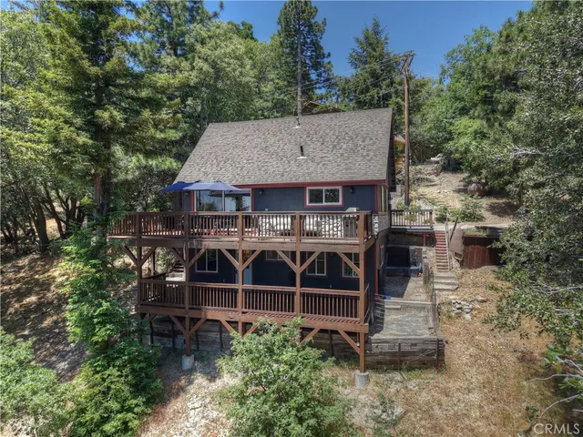 an aerial view of a house with mountain view
