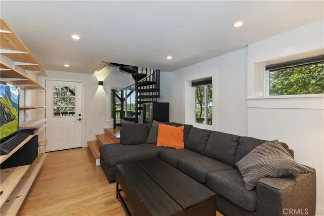 a view of balcony with furniture and wooden floor