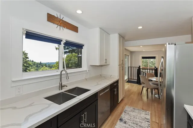 a living room with furniture flat screen tv and a fireplace